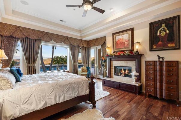 Bedroom, Fireplace, Interior, Recessed Lighting, Water, Wood Texture Flooring