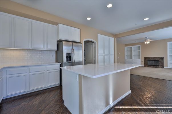 Fireplace, Interior, Kitchen, Recessed Lighting, Stainless Steel Appliances, Wood Texture Flooring