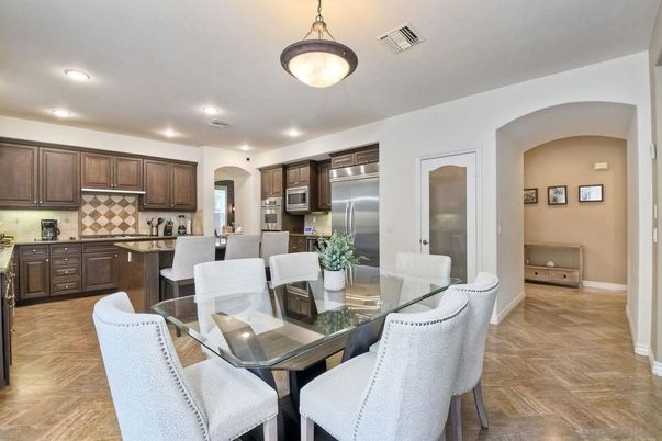 Dining room, Interior, Kitchen, Pendant Lights, Recessed Lighting, Stainless Steel Appliances, Wood Texture Flooring