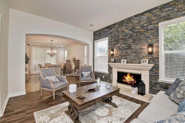 Chandelier, Dining room, Fireplace, Interior, Living room, Pendant Lights, Stone Walls, Wood Texture Flooring