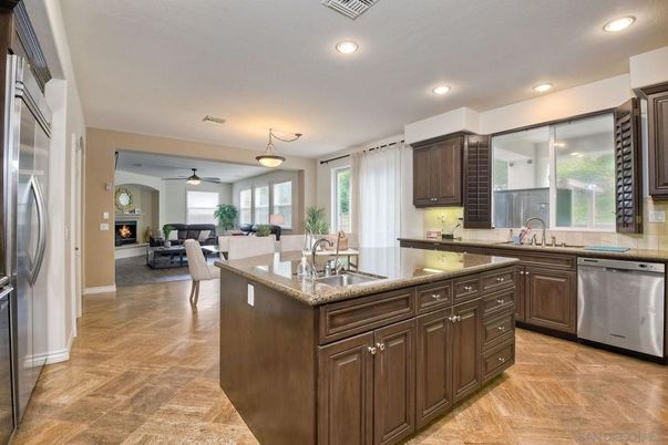 Dining room, Fireplace, Interior, Kitchen, Living room, Pendant Lights, Recessed Lighting, Stainless Steel Appliances, Wood Texture Flooring