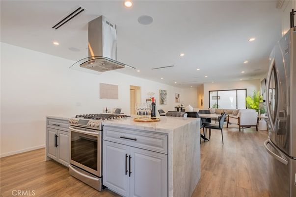 Dining room, Interior, Kitchen, Living room, Recessed Lighting, Stainless Steel Appliances, Wood Texture Flooring