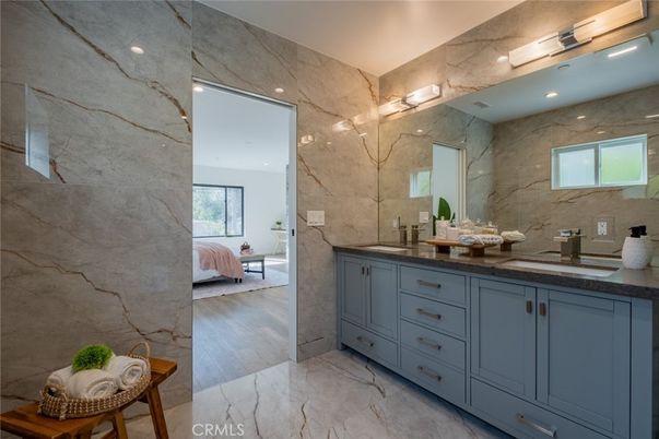 Bathroom, Bedroom, Dual Sink Vanities, Interior, Marble, Marble Walls, Recessed Lighting, Wood Texture Flooring
