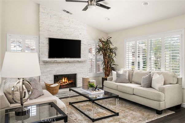 Fireplace, Interior, Living room, Recessed Lighting, Stone Walls, Wood Texture Flooring