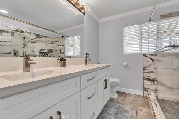 Bathroom, Dual Sink Vanities, Glass Shower, Interior, Marble Walls, Recessed Lighting