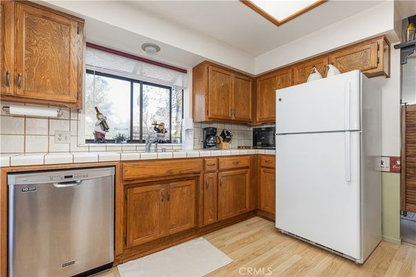 Interior, Kitchen, Stainless Steel Appliances, Tile Countertops, Wood Texture Flooring