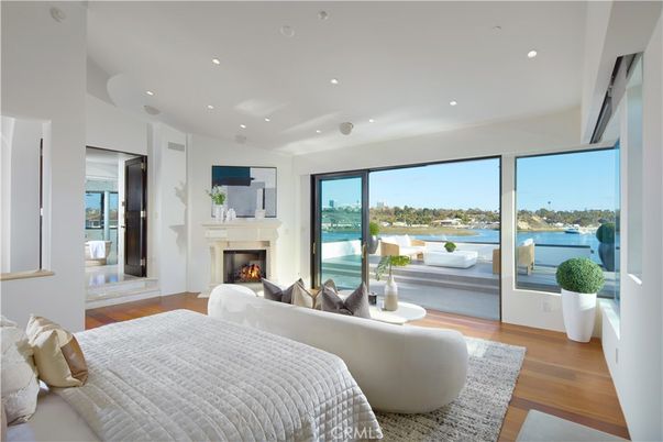 Bedroom, Fireplace, Interior, Recessed Lighting, Water, Wood Texture Flooring
