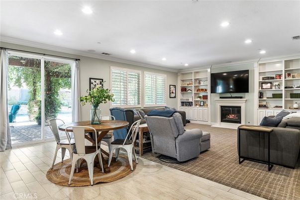 Dining room, Fireplace, Interior, Living room, Recessed Lighting, Wood Texture Flooring
