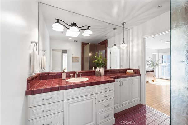Bathroom, Dual Sink Vanities, Interior, Pendant Lights, Tile Countertops, Wood Texture Flooring