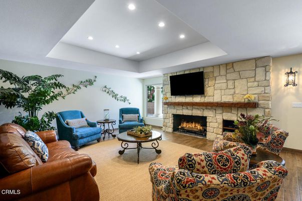 Fireplace, Interior, Living room, Recessed Lighting, Stone Walls, Wood Texture Flooring