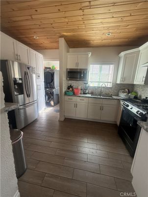 Interior, Kitchen, Recessed Lighting, Washer, Wooden Ceilings, Wood Texture Flooring