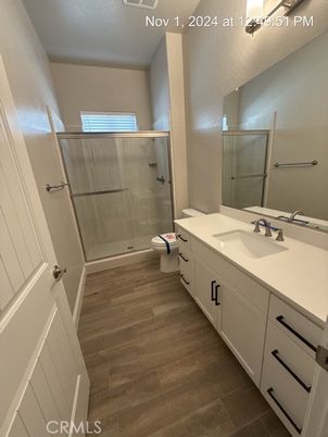Bathroom, Dual Sink Vanities, Glass Shower, Interior, Wood Texture Flooring
