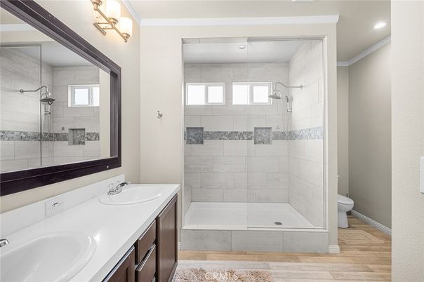 Bathroom, Dual Sink Vanities, Glass Shower, Interior, Recessed Lighting, Wood Texture Flooring