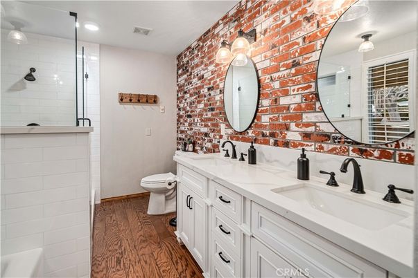 Bathroom, Dual Sink Vanities, Interior, Recessed Lighting, Wood Texture Flooring