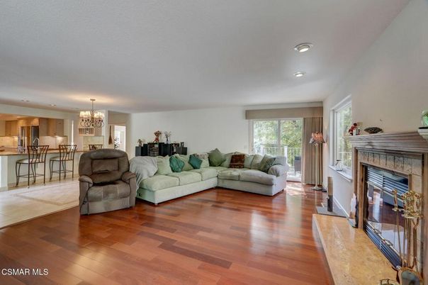 Chandelier, Fireplace, Interior, Kitchen, Living room, Recessed Lighting, Wood Texture Flooring