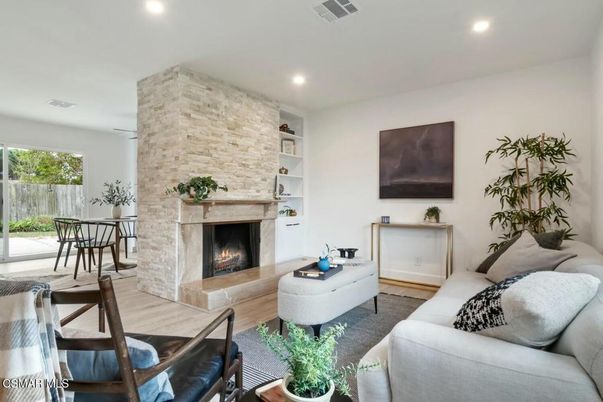 Fireplace, Interior, Living room, Recessed Lighting, Stone Walls, Wood Texture Flooring