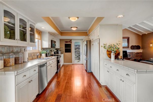 Interior, Kitchen, Recessed Lighting, Stainless Steel Appliances, Tile Countertops, Wood Texture Flooring