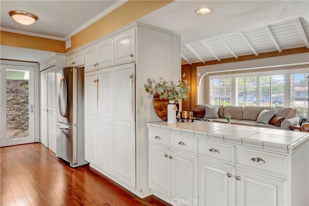 Interior, Kitchen, Recessed Lighting, Tile Countertops, Wood Texture Flooring