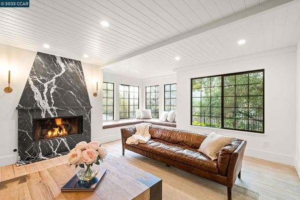 Fireplace, Interior, Living room, Marble Walls, Recessed Lighting, Wood Texture Flooring