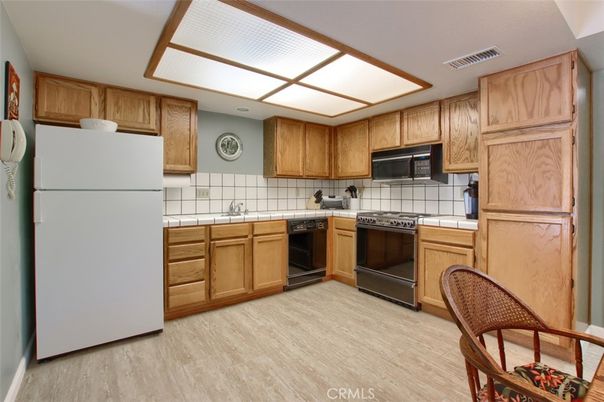 Dining room, Interior, Kitchen, Living room, Tile Countertops, Wood Texture Flooring
