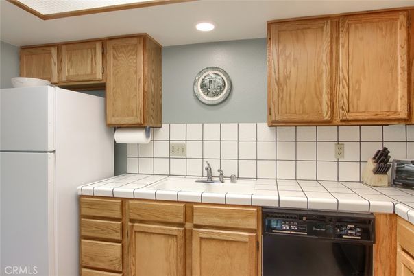 Interior, Kitchen, Recessed Lighting, Tile Countertops, Wood Texture Flooring