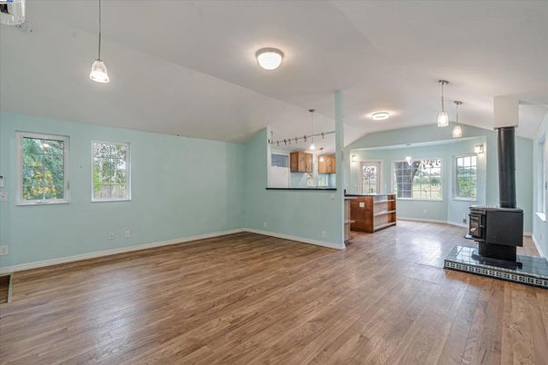 Empty room, Fireplace, Interior, Kitchen, Pendant Lights, Wood Texture Flooring