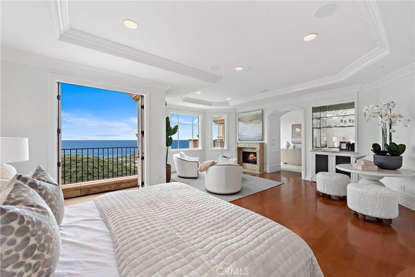 Bedroom, Fireplace, Interior, Recessed Lighting, Water, Wood Texture Flooring