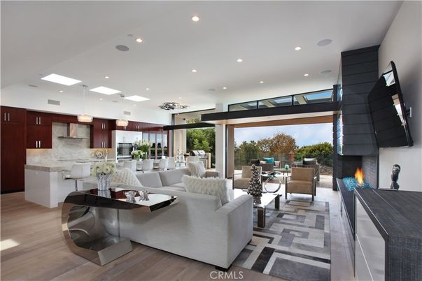 Fireplace, Interior, Kitchen, Living room, Pendant Lights, Recessed Lighting, Stainless Steel Appliances, Wood Texture Flooring