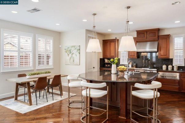 Dining room, Interior, Kitchen, Pendant Lights, Recessed Lighting, Stainless Steel Appliances, Wood Texture Flooring