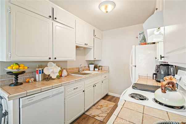 Interior, Kitchen, Tile Countertops, Wood Texture Flooring