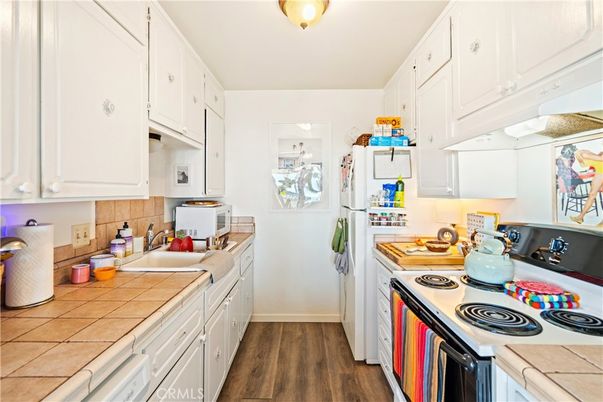 Interior, Kitchen, Tile Countertops, Wood Texture Flooring