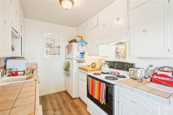 Interior, Kitchen, Tile Countertops, Wood Texture Flooring