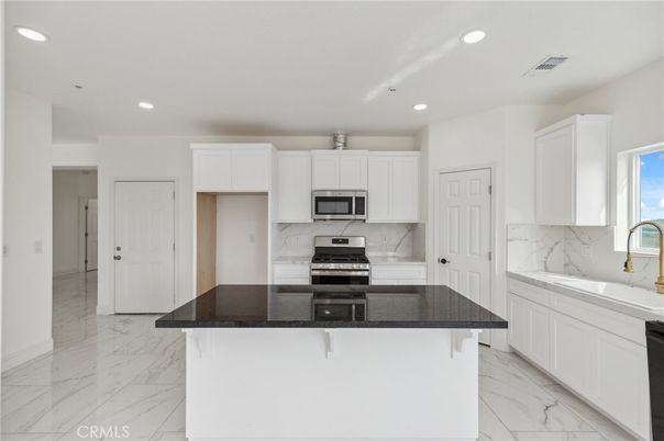 Interior, Kitchen, Marble, Marble Walls, Recessed Lighting, Stainless Steel Appliances