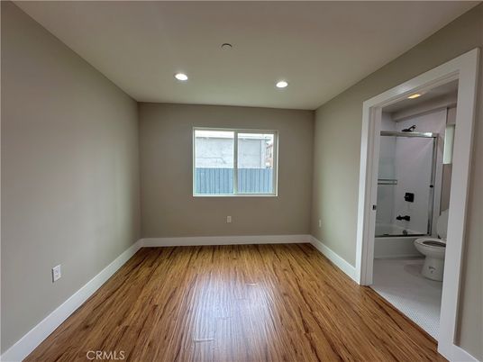 Bathroom, Empty room, Glass Shower, Interior, Recessed Lighting, Wood Texture Flooring