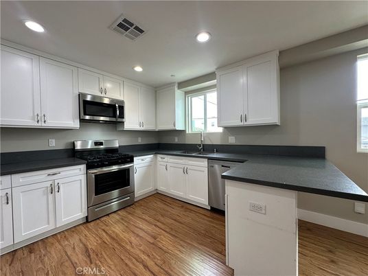 Interior, Kitchen, Recessed Lighting, Stainless Steel Appliances, Wood Texture Flooring
