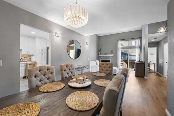Chandelier, Dining room, Fireplace, Interior, Living room, Pendant Lights, Recessed Lighting, Wood Texture Flooring