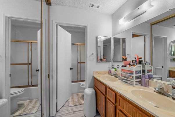 Bathroom, Dual Sink Vanities, Glass Shower, Interior, Wood Texture Flooring