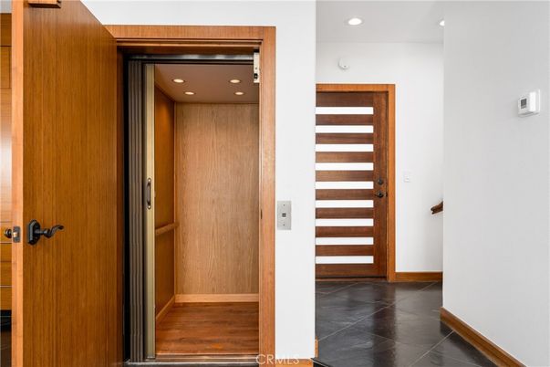 Elevator, Interior, Recessed Lighting, Wood Texture Flooring, Wooden Walls