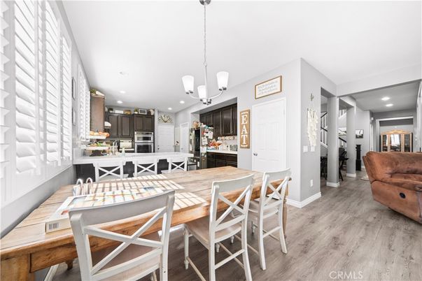 Dining room, Interior, Kitchen, Pendant Lights, Recessed Lighting, Stainless Steel Appliances, Wood Texture Flooring