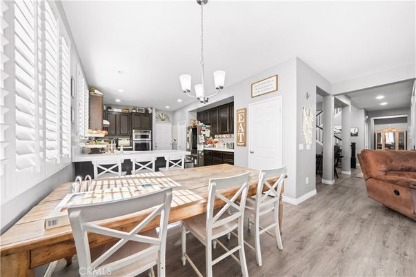 Dining room, Interior, Kitchen, Pendant Lights, Recessed Lighting, Stainless Steel Appliances, Wood Texture Flooring
