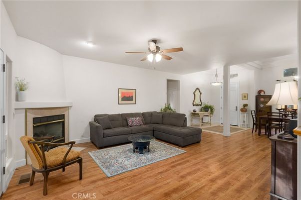 Dining room, Fireplace, Interior, Living room, Pendant Lights, Recessed Lighting, Wood Texture Flooring