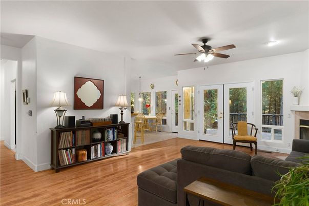 Dining room, Fireplace, Interior, Living room, Recessed Lighting, Wood Texture Flooring