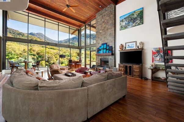 Dining room, Fireplace, Interior, Living room, Recessed Lighting, Stone Walls, Wooden Ceilings, Wood Texture Flooring