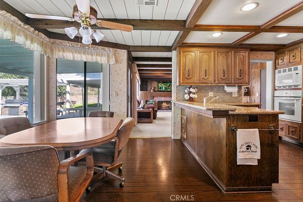 Dining room, Fireplace, Interior, Kitchen, Recessed Lighting, Wooden Beams, Wood Texture Flooring