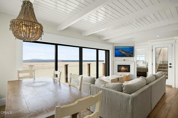 Chandelier, Dining room, Fireplace, Interior, Living room, Recessed Lighting, Water, Wood Texture Flooring