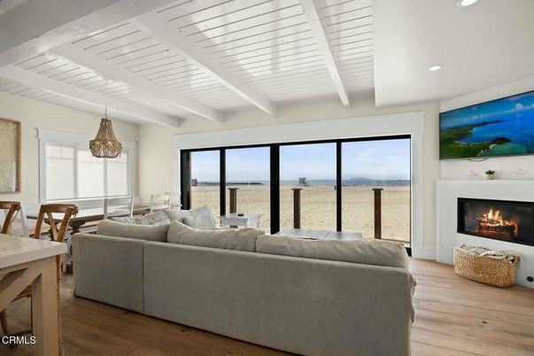 Dining room, Fireplace, Interior, Living room, Recessed Lighting, Water, Wood Texture Flooring