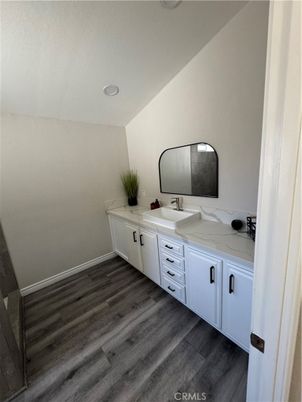 Bathroom, Dual Sink Vanities, Interior, Recessed Lighting, Wood Texture Flooring