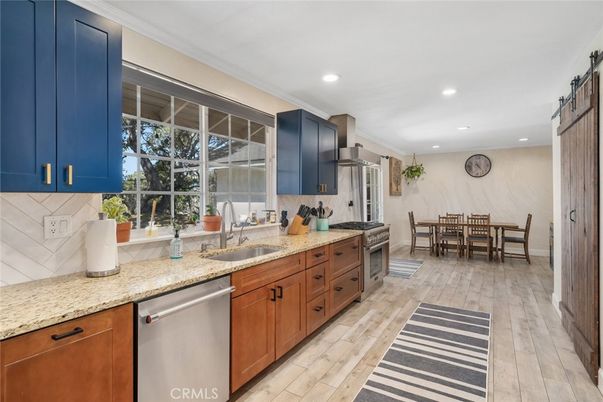 Dining room, Interior, Kitchen, Recessed Lighting, Stainless Steel Appliances, Wood Texture Flooring