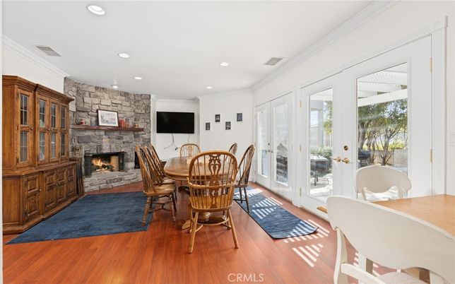 Dining room, Fireplace, Interior, Recessed Lighting, Stone Walls, Wood Texture Flooring