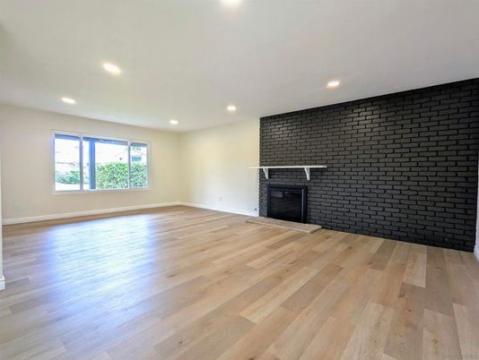 Empty room, Fireplace, Interior, Recessed Lighting, Stone Walls, Wood Texture Flooring